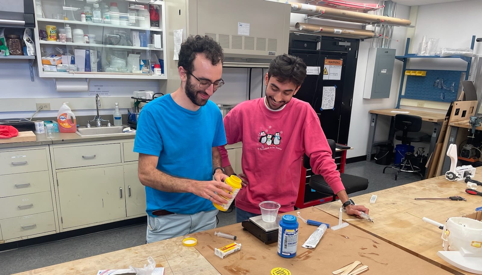 Graduate student advisor Daniel Esser pouring silicone mold